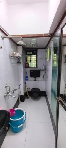 a small bathroom with a toilet and a sink at Dreamland- The flat of your dreams/ Entire 1bhk Apartment in Mumbai