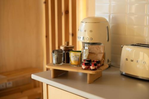 a kitchen counter with a coffee maker on a counter top at Casa Raposa Lodges - Terrace Mountain View in Manteigas