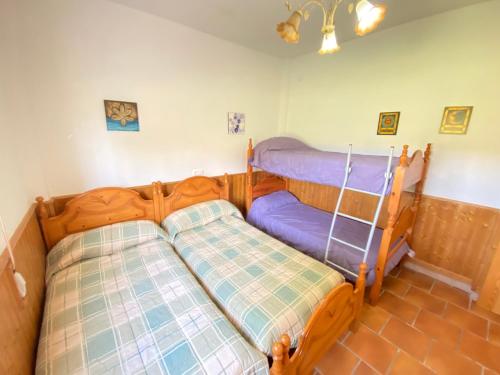 two bunk beds in a room with at VILLA LÚA in Cartaya