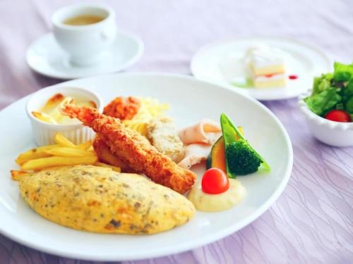a white plate of food with fried fish and french fries at Wellness Forest Nasu in Nasu