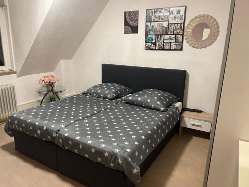 a bedroom with a bed with two pillows on it at Landgasthof im Schwarzwald ideal für Wanderer & Biker in Pforzheim