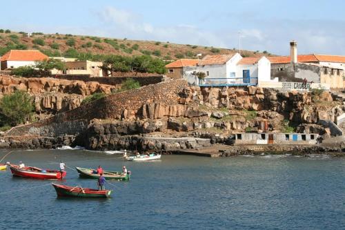 a group of boats in a body of water at Casa Tartaruga in Carriçal