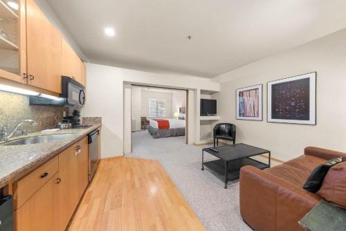 a kitchen and living room with a couch and a bed at Palisades Tahoe Lodge Rentals Studio #152 in Olympic Valley