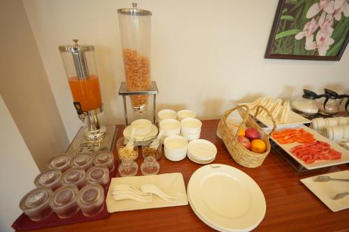 a table with a blender and some food on it at Cilantro Comfort in Gangtok