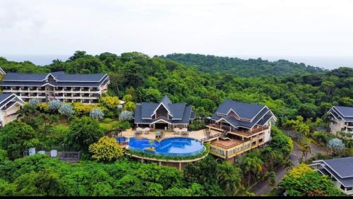 an aerial view of a house with a swimming pool at Alta Vista De Boracay Hymettus 109 in Boracay