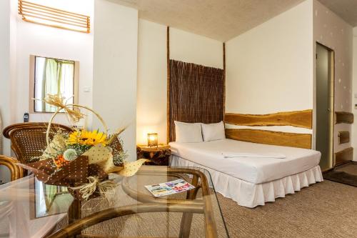 A bed or beds in a room at Art Hotel Simona