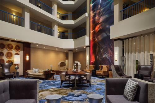 a lobby of a hotel with couches and a table at Delta Hotels by Marriott Philadelphia Airport in Philadelphia