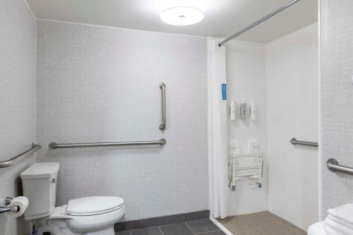 a bathroom with a toilet and a shower at Hampton Inn Athens in Athens