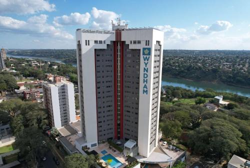 an aerial view of a tall white building at Wyndham Golden Foz Suítes in Foz do Iguaçu