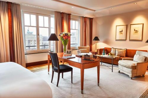a hotel room with a bed and a desk at Hotel Adlon Kempinski Berlin in Berlin