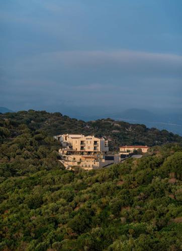 a house on top of a hill with trees at Radisson Blu Hotel, Kas in Kas