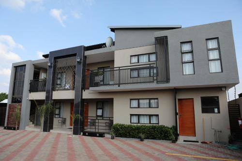 a large apartment building with a lot of windows at The Edge Lodge in Polokwane
