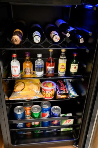 a refrigerator filled with lots of food and drinks at Revive Boutique Hotel in Yerevan