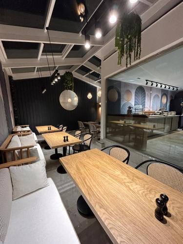 a restaurant with tables and chairs in a room at Mona Bosphorus in Istanbul