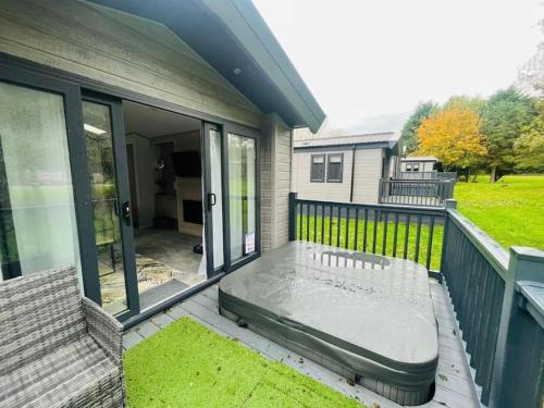 a balcony with a mattress on a house at Wag Tail Lodge with Hot Tub in Barmby on the Moor