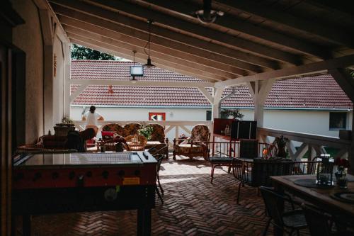 a living room with a person sitting on a couch at Kosowisko in Miłki