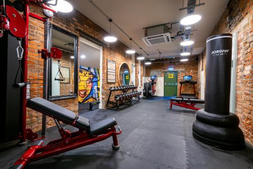 a gym with a punching bag in a brick wall at Prom Hotel in Great Yarmouth