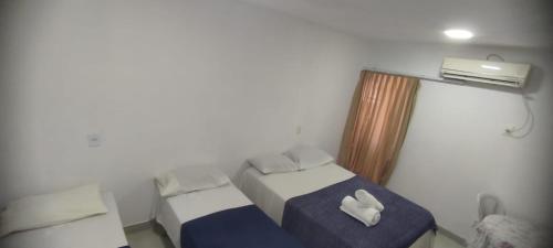 Ένα ή περισσότερα κρεβάτια σε δωμάτιο στο Suites Mariano