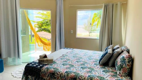 Postel nebo postele na pokoji v ubytování Pousada OPA - O Paraíso é Aqui Abrolhos