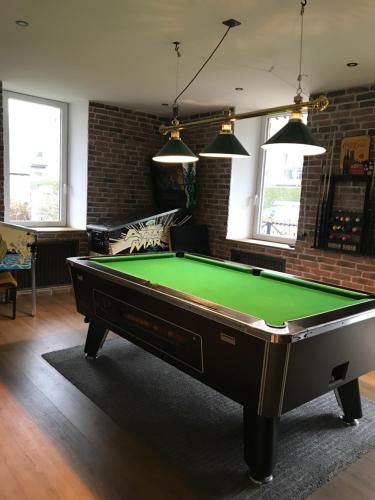 a pool table in the middle of a living room at Chambre Sallanches in Sallanches