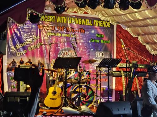 a stage with a guitar and a bicycle on it at Lavila beach cottage in Wadduwa