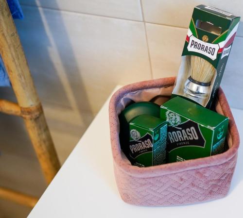 a basket filled with toothbrushes and toothpaste at New Living Milano in Gorgonzola