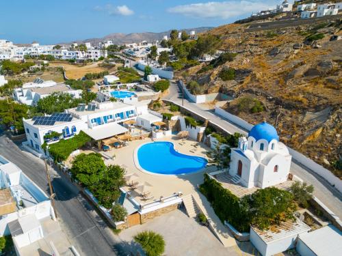 an aerial view of a village with a pool and a church at Fanari Art in Ios Chora