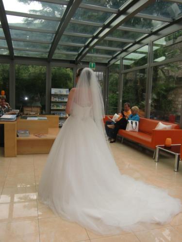 a woman in a wedding dress in a room at Beach Hotel Du Lac Malcesine in Malcesine