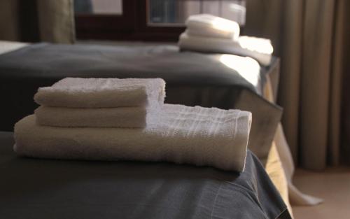 Łóżko lub łóżka w pokoju w obiekcie Hotel Cerros del Norte