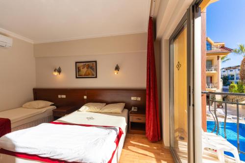 Кровать или кровати в номере ASTORIA PARK HOTEL & Spa ALL INCLUSIVE CONCEPT
