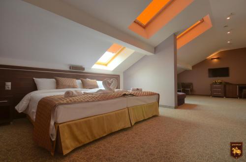 a bedroom with a large bed in a room at CTKiR Browar Probus in Oława