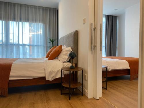 a hotel room with a bed and a window at River House Near The Peoples Square And The Bund in Shanghai