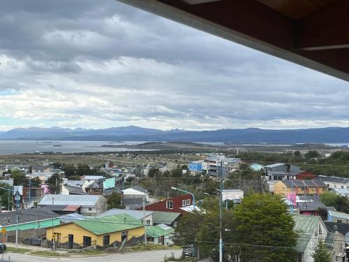 a view of a small town with mountains in the background at Ushuaia aparts Depto 2 in Ushuaia