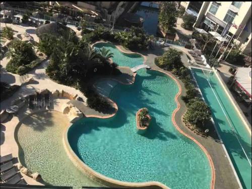 an aerial view of a pool at a resort at APARTMENT IN OCEAN VILLAGE, SLEEPS UP TO 6 in Gibraltar