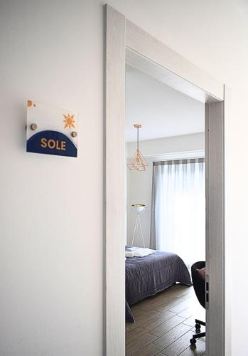 a door leading to a bedroom with a bed at B&B Da Bea in Chieti