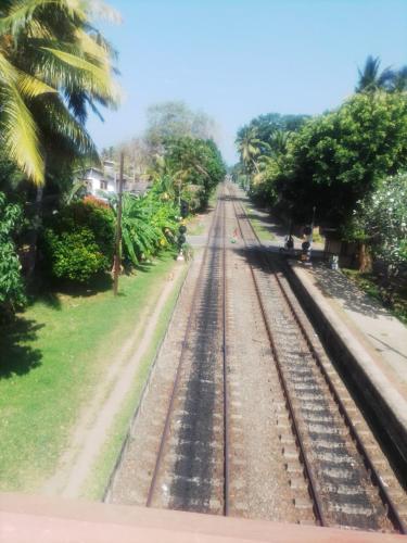 a view of the railroad tracks from a train at Our Little Secret in Kalutara
