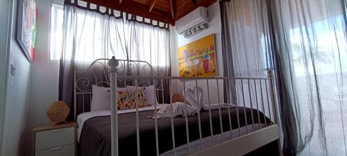 a bedroom with a bed with a canopy at Venere Bayahibe by Mireya in Bayahibe