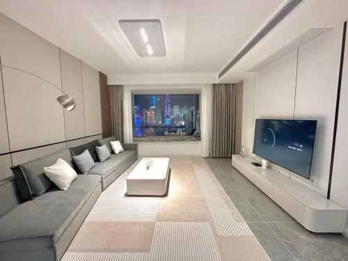 Μια τηλεόραση ή/και κέντρο ψυχαγωγίας στο Shanghai Shining River Apartment -Near the Bund