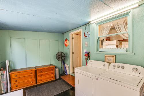 a laundry room with a washing machine and a window at Gardena Vacation Rental 5 Mi to Manhattan Beach! in Gardena