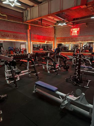 a gym with a bunch of exercise equipment in it at Maze apartments and rooms Free parking in Hull