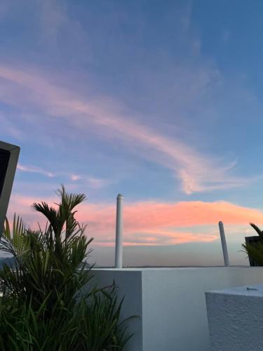 a view of the sunset from the balcony of a house at BlissFul Homestay_Horizon@IPOH in Ipoh