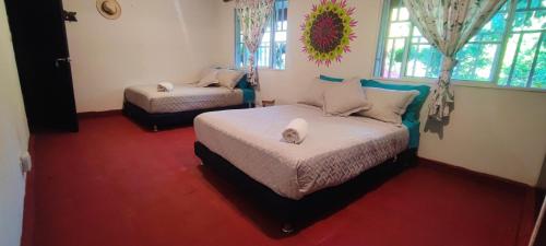 Katil atau katil-katil dalam bilik di Casa Bosco Minca