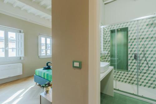 a white bathroom with a sink and a shower at Casa Pino 2 bedrooms 2 bathrooms contemporary apar in Lucca