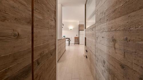 a hallway with wooden walls in a house at Villa Zeta in Bordighera