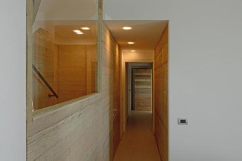 a hallway of a house with a mirror on the wall at Villa Zeta in Bordighera