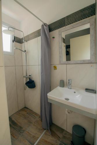 a bathroom with a sink and a mirror at Olympian Heights in Olympia