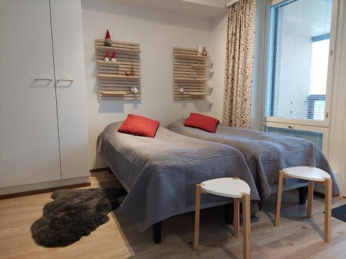 Katil atau katil-katil dalam bilik di Arctic Aurora Luxury, Lehtikatu 2A 96100 Rovaniemi