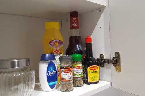 a shelf in a refrigerator with spices and condiments at *L'Anatole*/Haute Ville/TULLE in Tulle