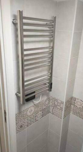 a bathroom with a shower with a towel dispenser at Appartamento con cortile a 30 mt. dal mare in Bari