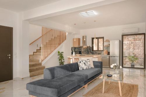 a living room with a couch and a table at Kefalonia Grande Horizon in Ayia Evfimia